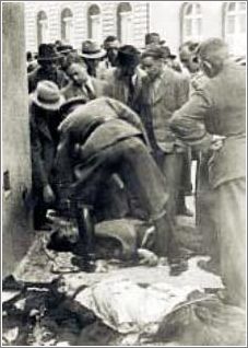 The dead paratroopers were carried out in front of the crypt, Karl Hermann Frank is beding over one of the corpses